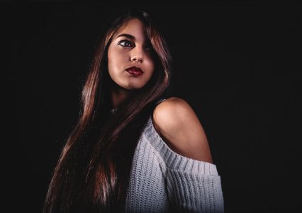 selective focus of woman wearing white top photo