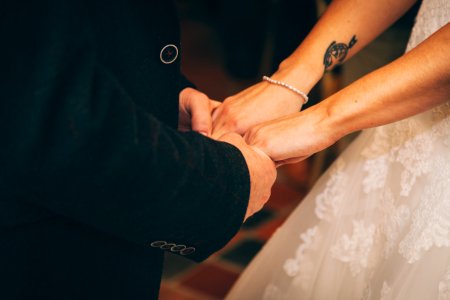 man and woman holding each others hand photo