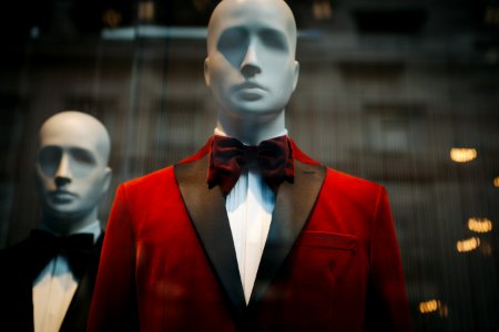 mannequin wearing red notched lapel suit jacket