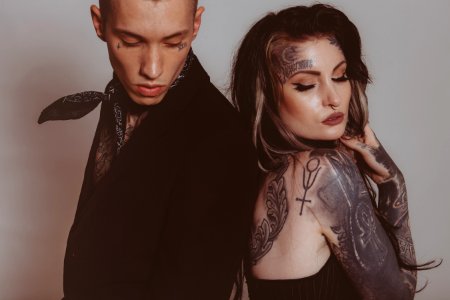 man and woman with tattoos photo