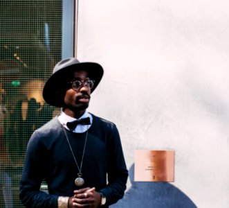 man in black sweatshirt and hat photo