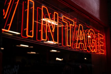 red neon signage on glass wall photo