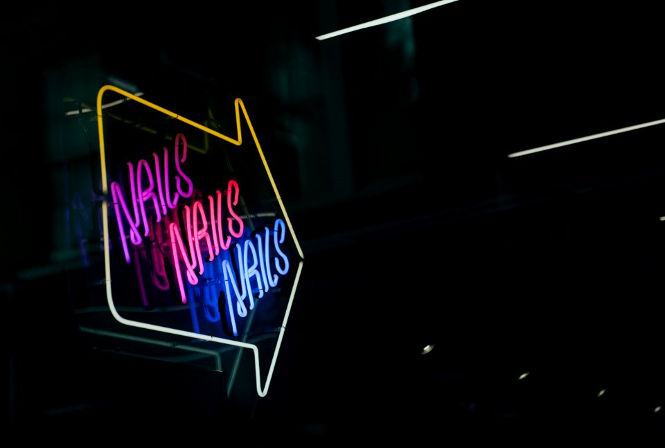 Nails neon signage to the right