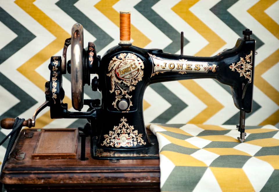 white and yellow chevron cloth on black sewing machine