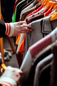 person holding hang clothes photo