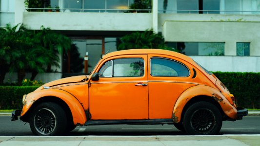 shallow focus photography of orange Volkswagen Beetle photo