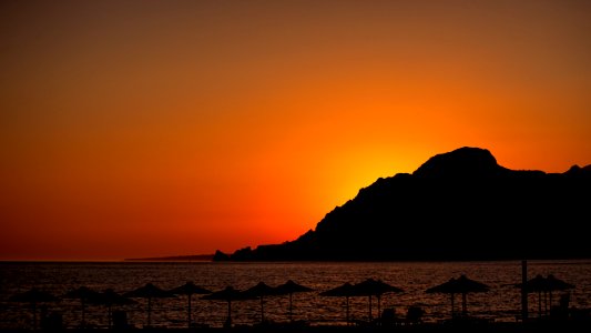 silhouette of mountain during sun set photo