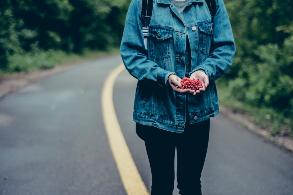 person standing on a road