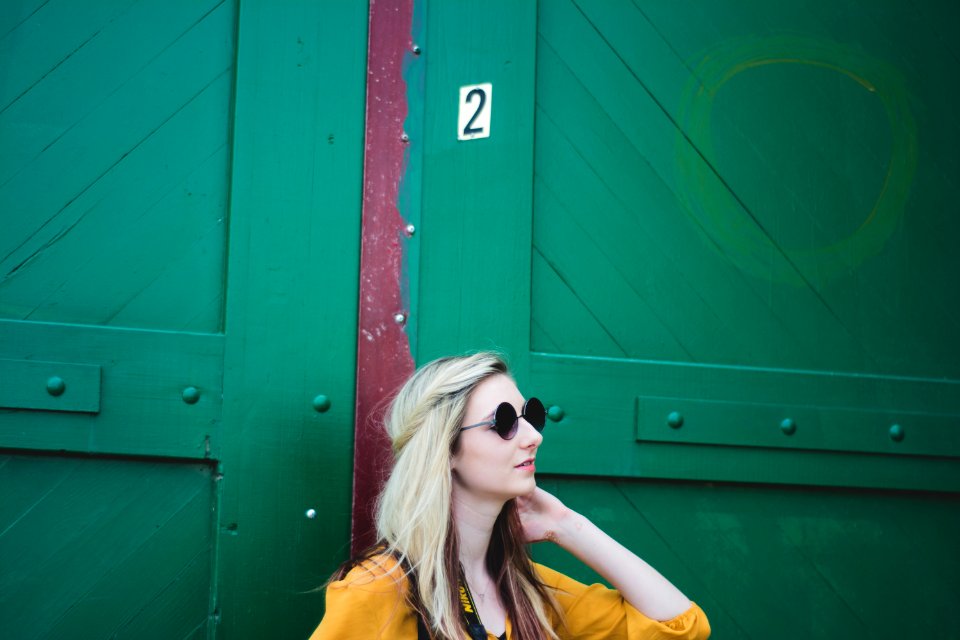 woman leaning on door