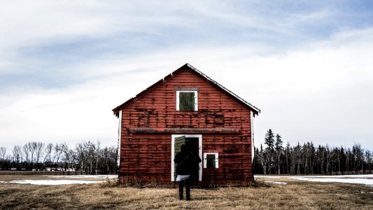 person standing in front of rd barn photo