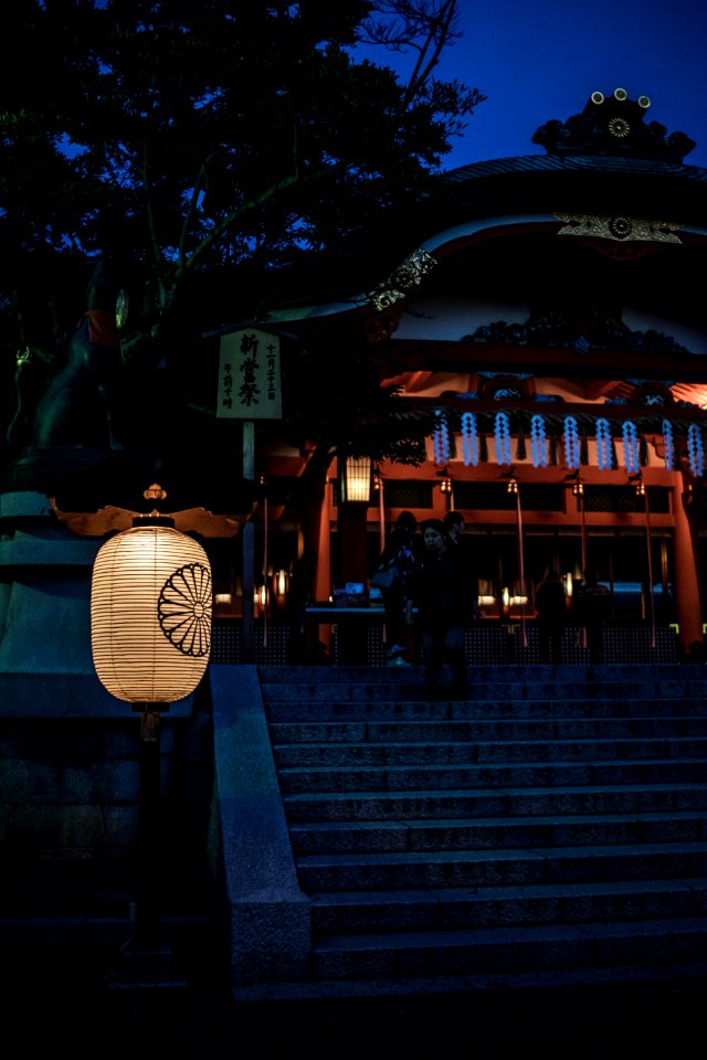 lighted street light near building