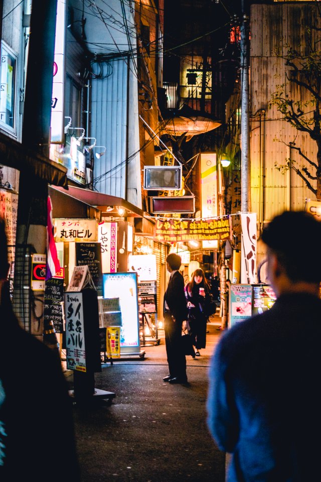 people walking beside building