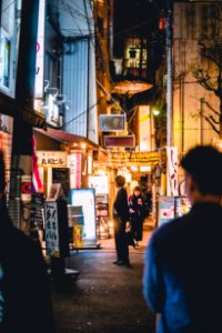 people walking beside building