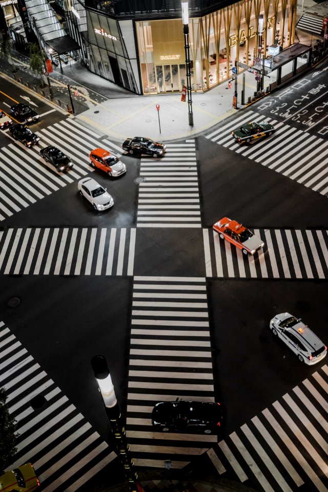 aerial view photo of vehicles crossing road