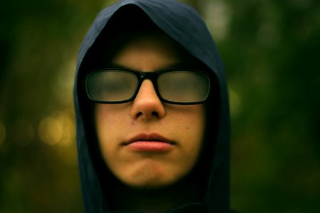 selective focus photography of man wearing eyeglasses photo