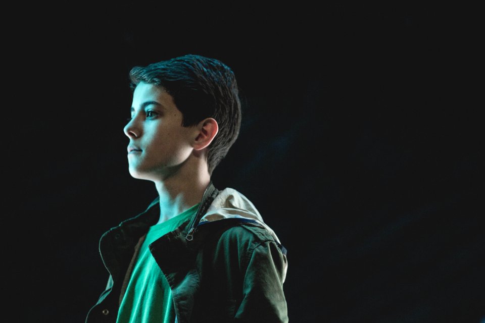 man in green and black jacket