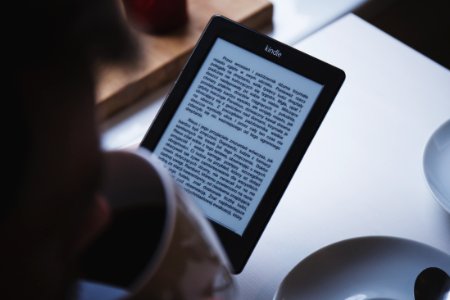 turned on black Amazon Kindle e-book reader photo