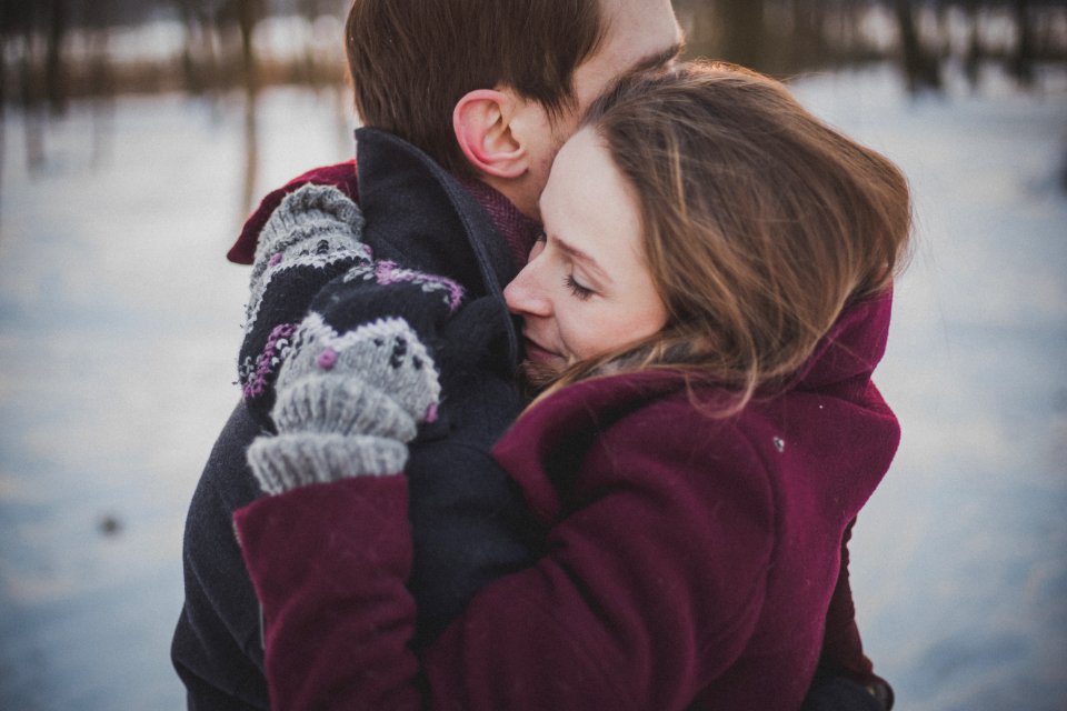 man and woman hugging each other photo