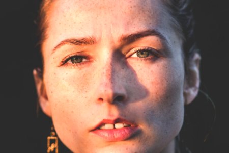 sun rays of woman's face photo