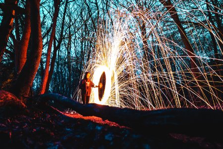 woman in the middle of forest steelwool photo photo