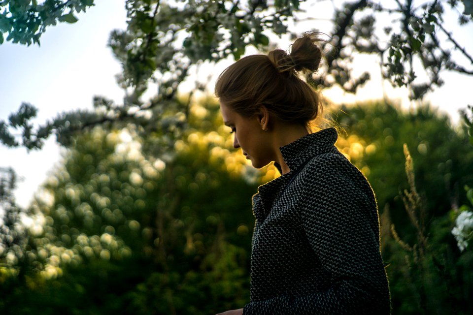 selective focus photography of woman wearing black jacket photo