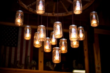 clear glass mason jar hanging lamp turned on
