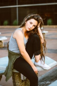 woman sitting on picnic table photo