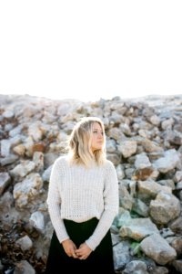 woman in gray sweater and black skirt photo