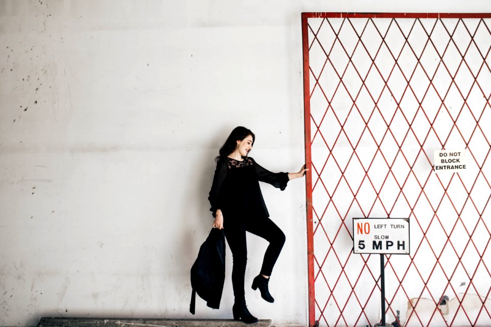 woman carrying black bag