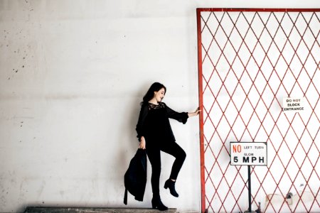 woman carrying black bag