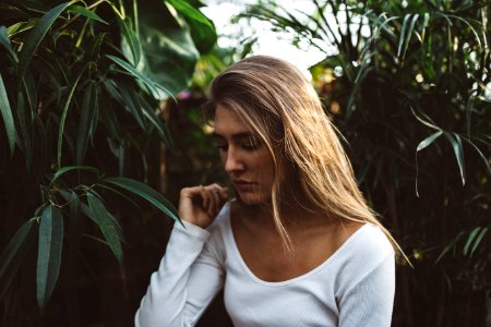 woman near green leafed plants photo