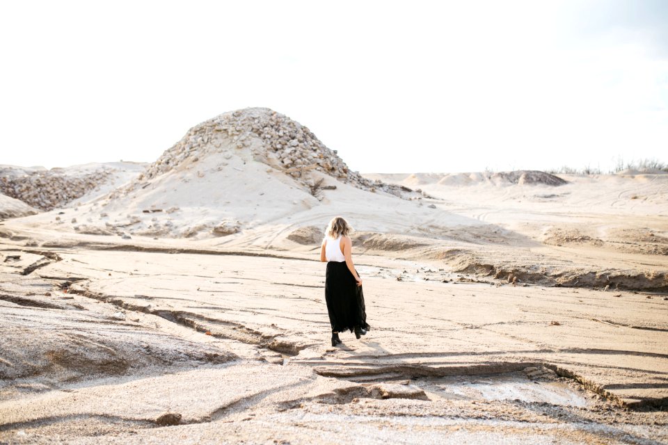 person walking on desert