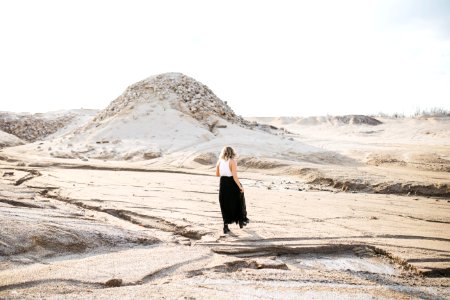 person walking on desert photo