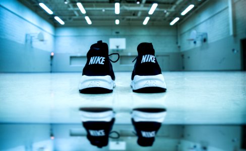 pair of black-and-white Nike athletic shoes photo