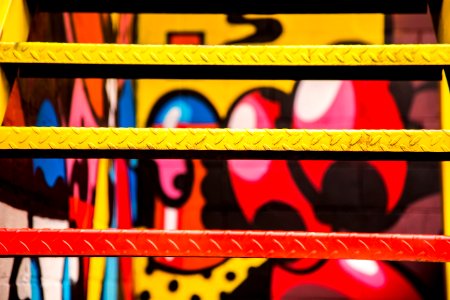 red and yellow painted metal stairs photo