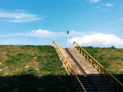 brown concrete stairs under clear blue sky photo