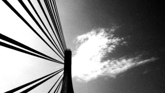 low angle photography of bridge wire under clouds photo