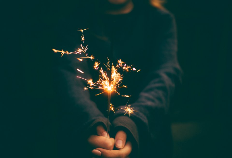person holding sparkler