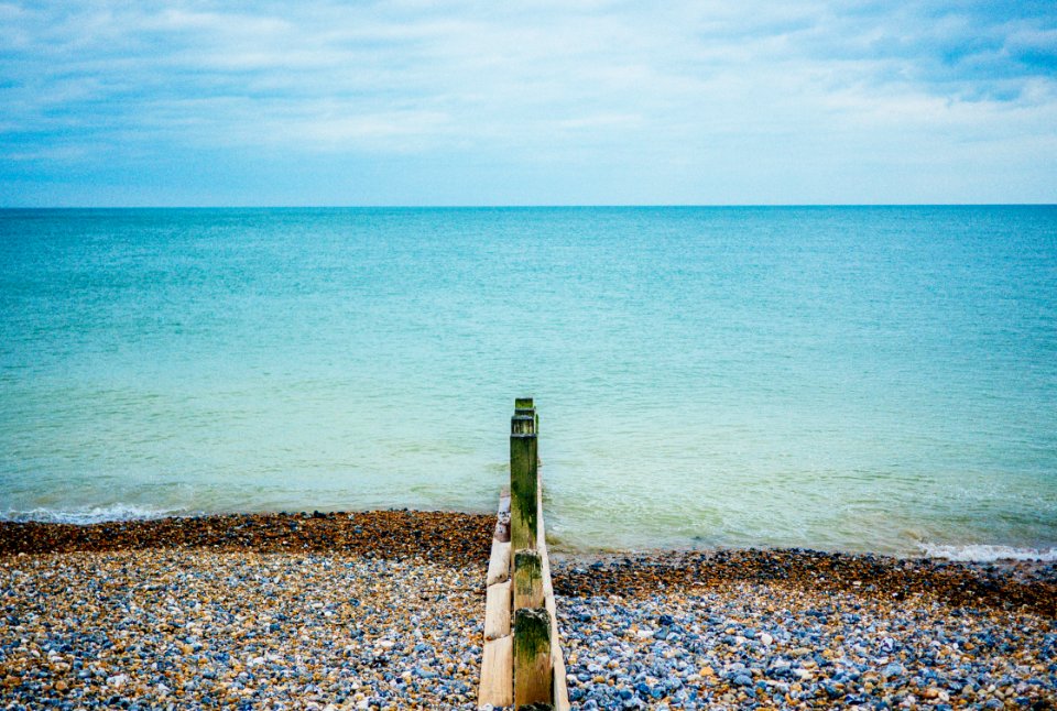 rocks near calm ocean
