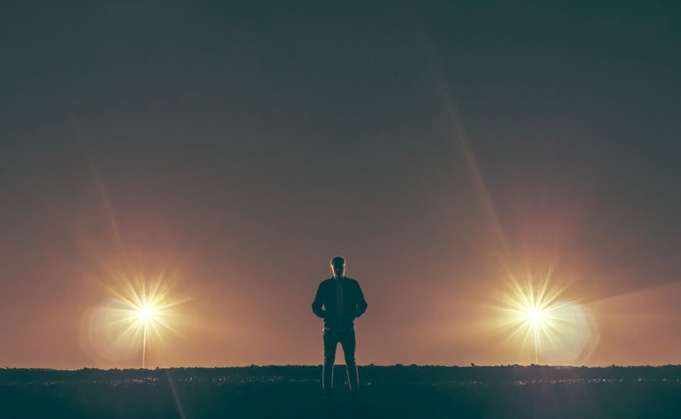 man standing in the middle of nowhere