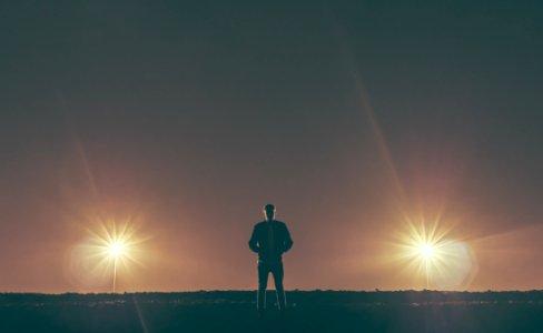 man standing in the middle of nowhere