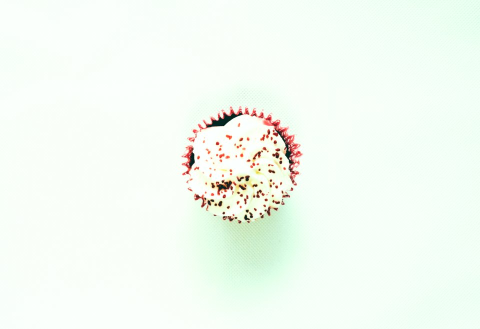 shallow focus photo of white cupcake