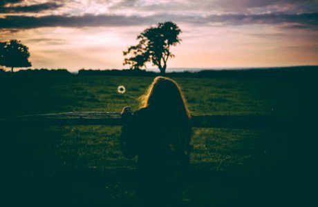 woman leaning on rail