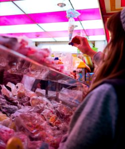 woman standing near plastic packs