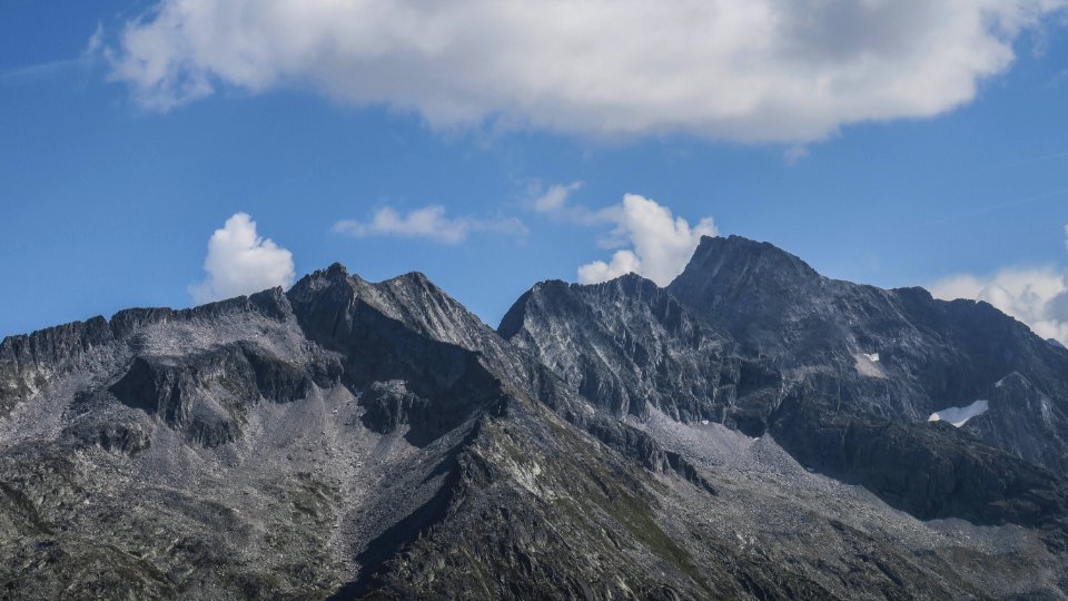 green and gray mountain under blue sky during daytime photo