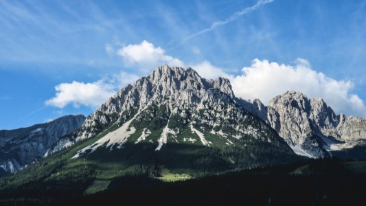 photo of grey mountain under blue sky