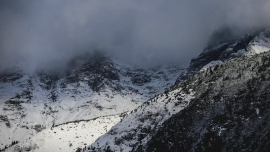 aerial photography of fog covering mountain top photo