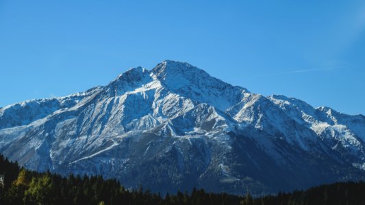 snow covered mountain during daytime photo