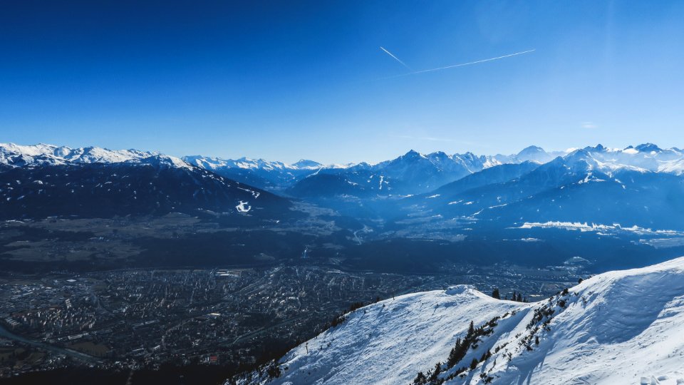 snow covered mountains under blue sky during daytime photo