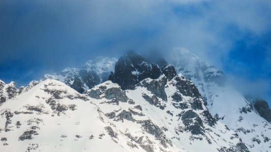black mountain with snowy terrain photo